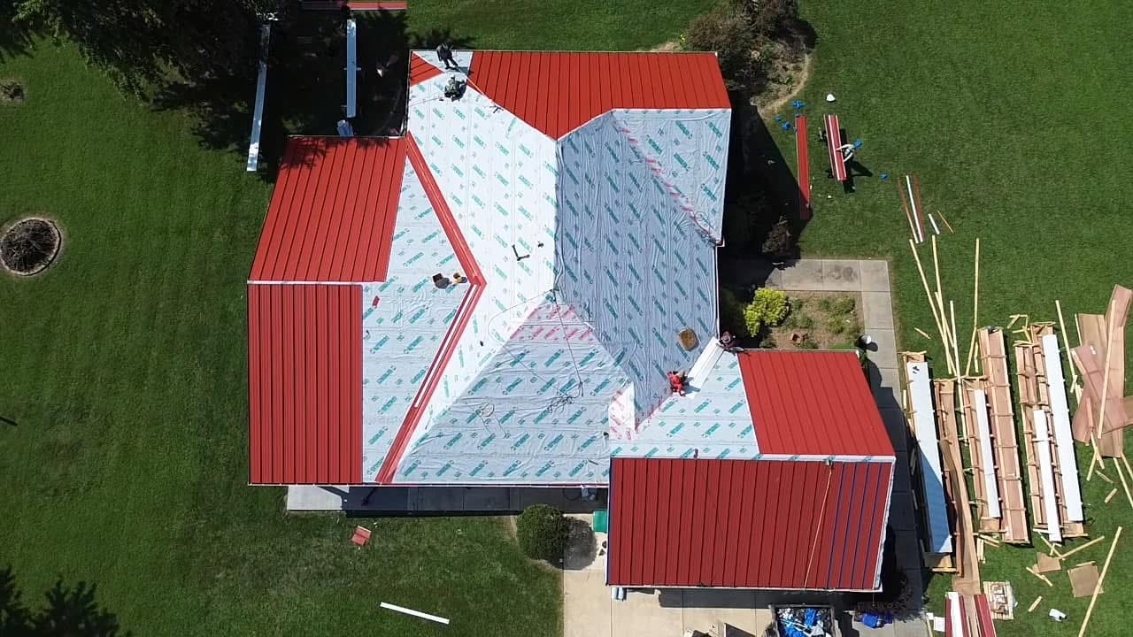 Aerial drone red metal roof installation in St. Louis MO