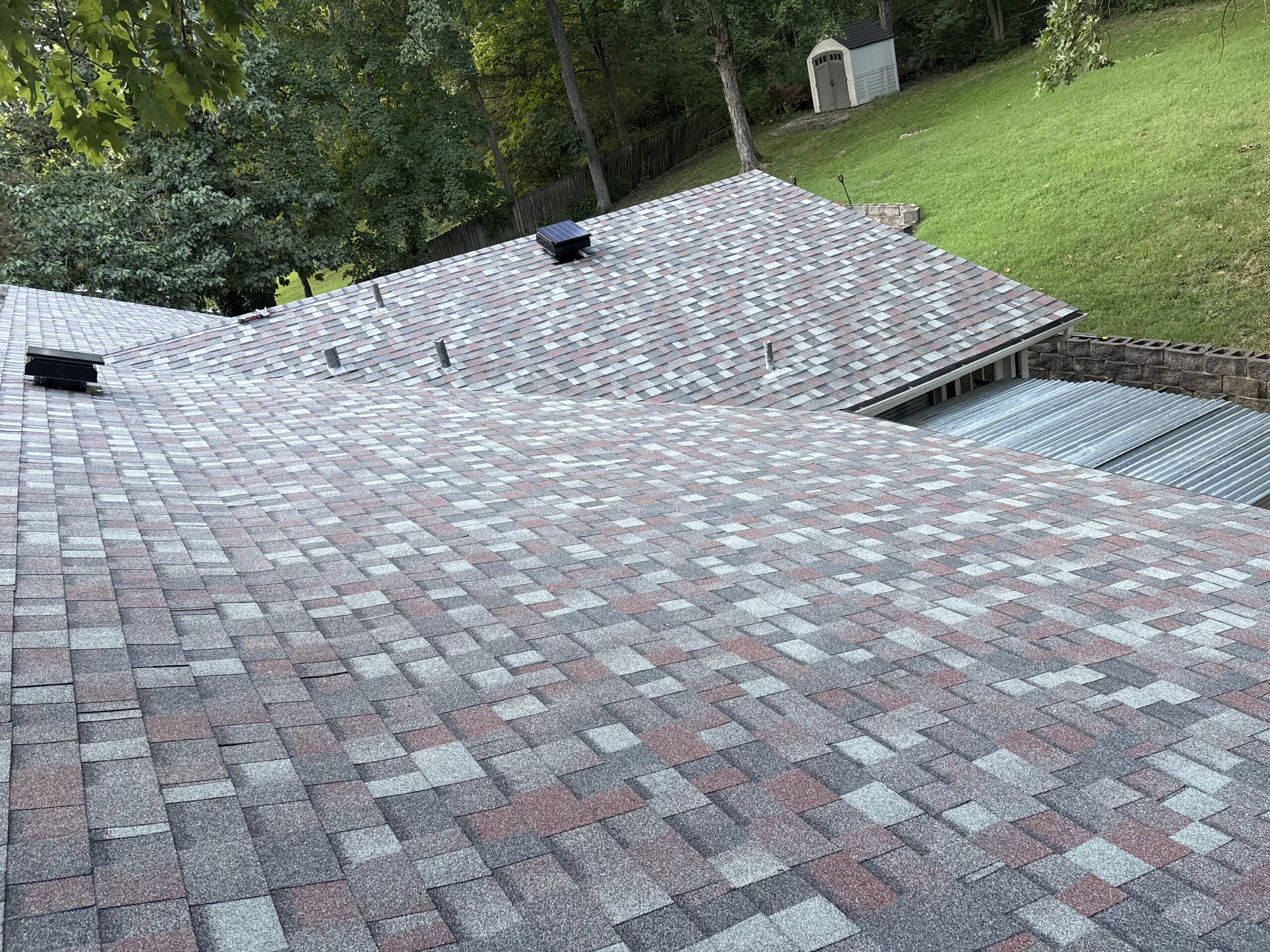 Elevated view completed grey shingle roof replacement in Wildwood MO