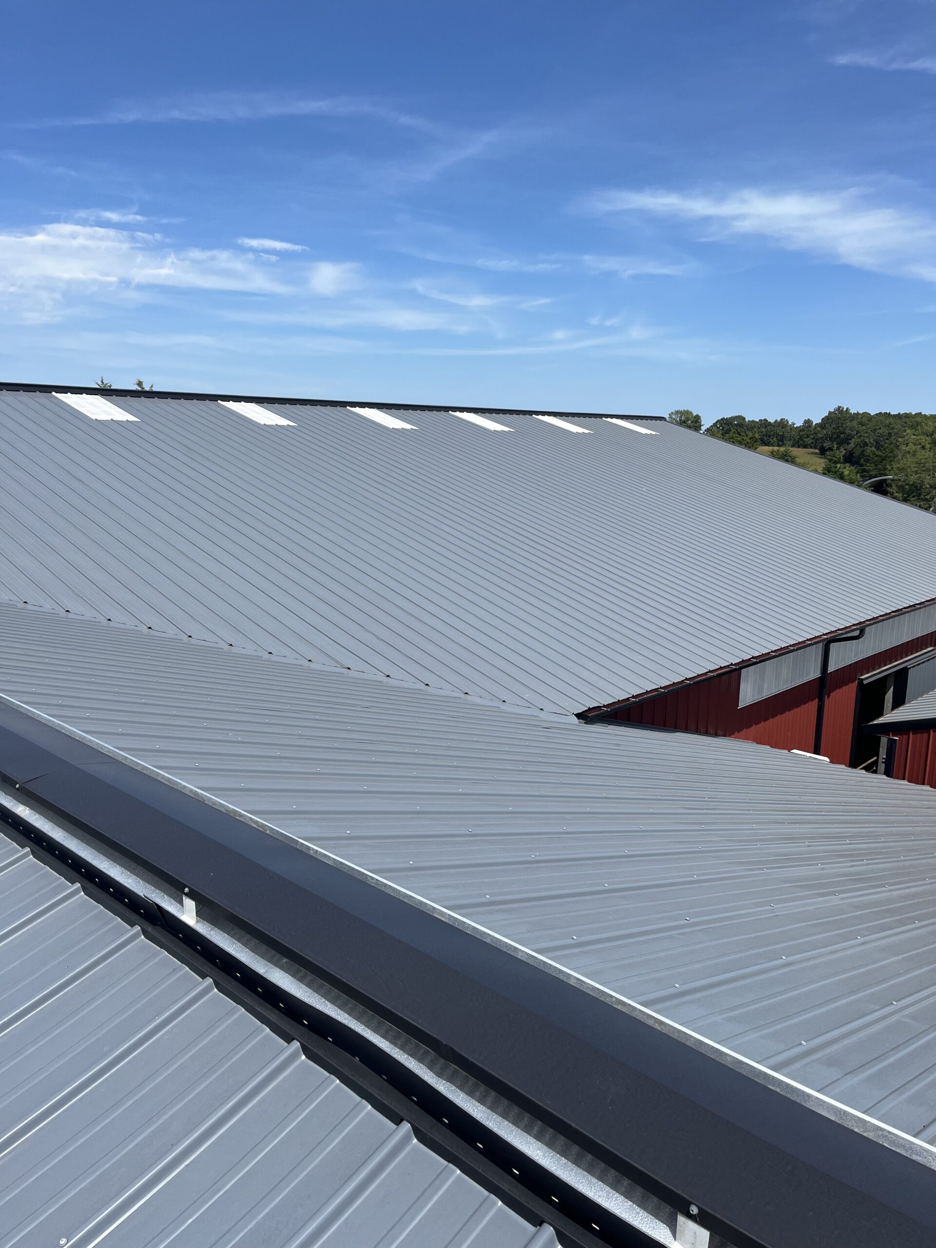 Grey metal standing seam roofing installation in St. Charles County MO