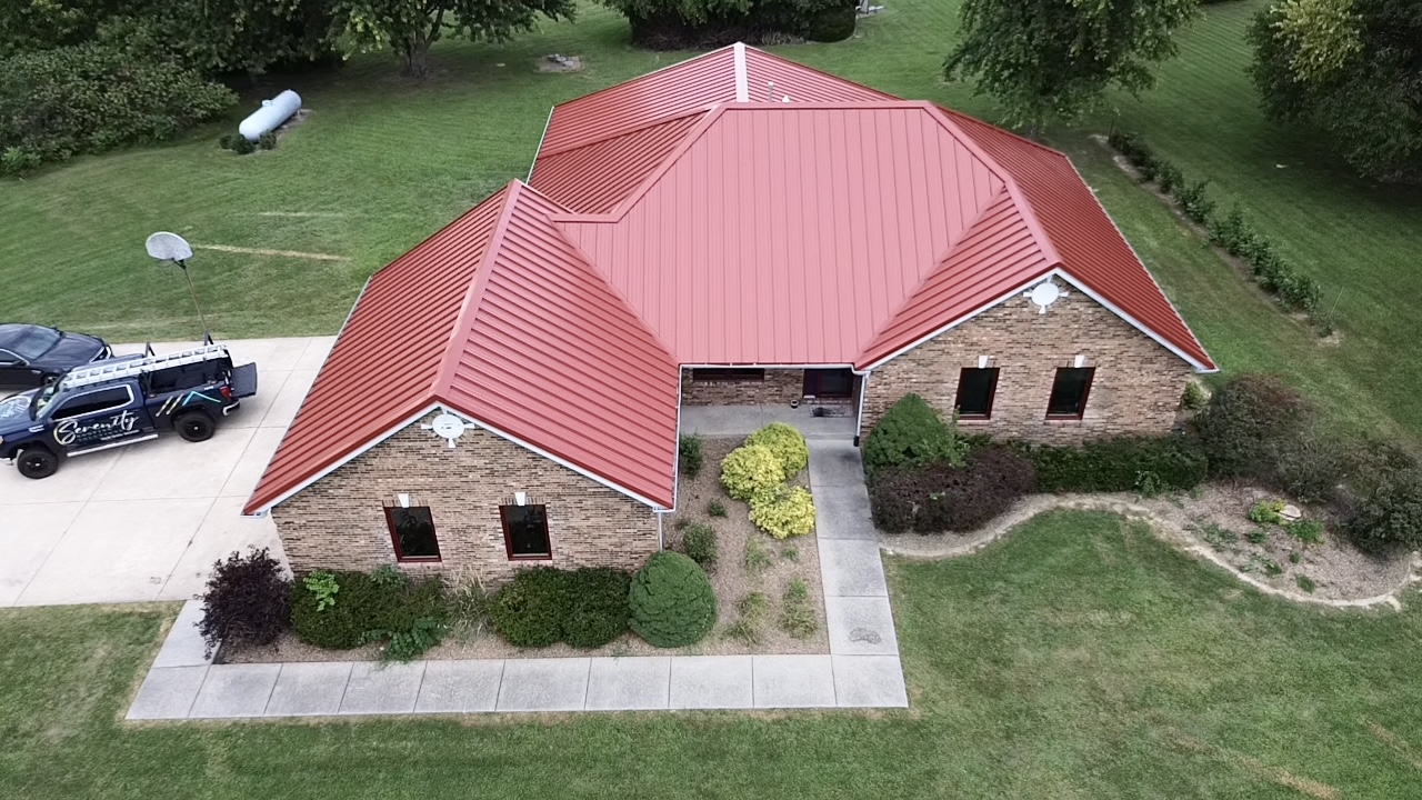 Standing seam red metal roof installation in Arnold MO